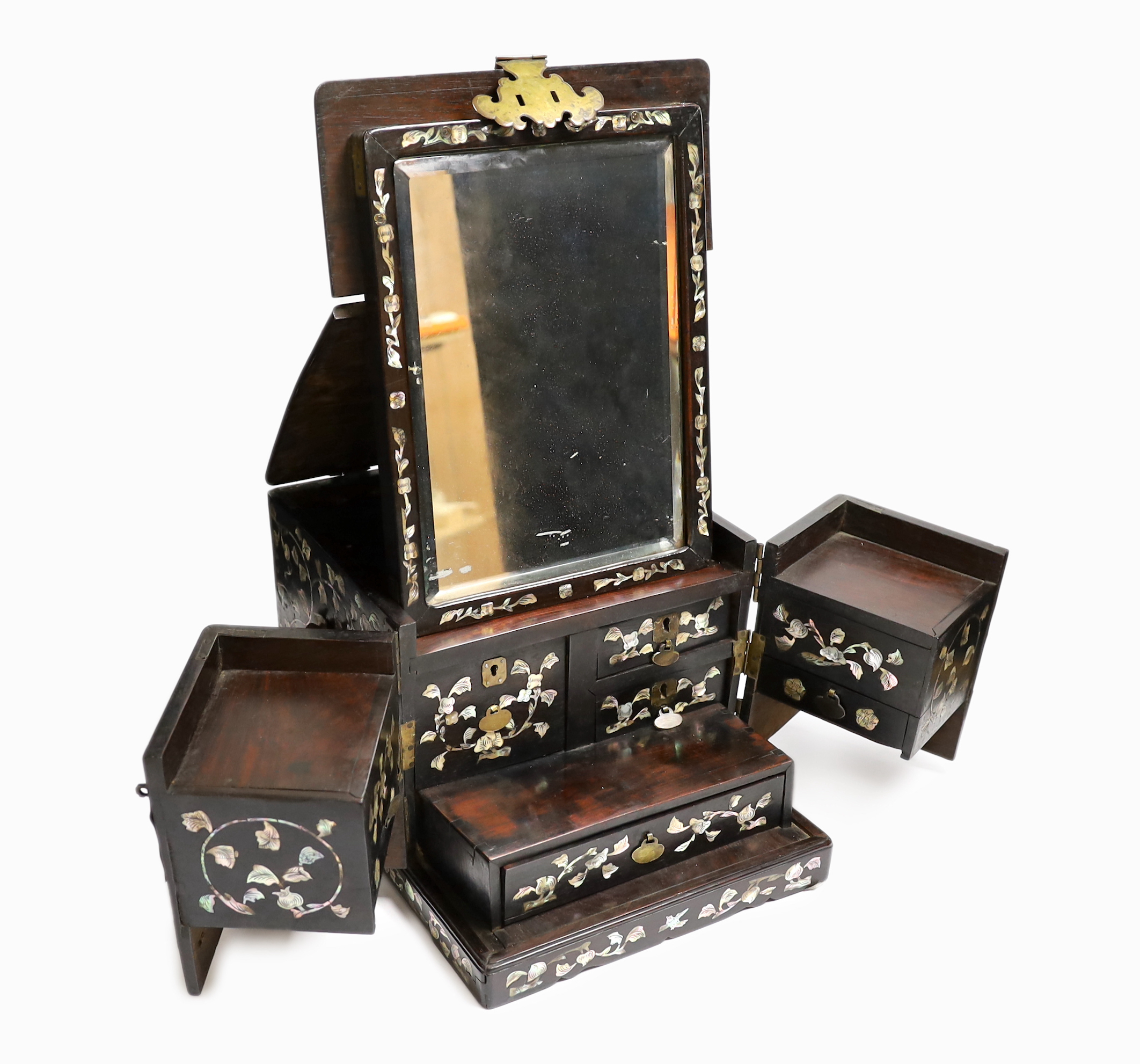 A Chinese mother-of- pearl inlaid hongmu vanity cabinet, late Qing dynasty, with fitted interior comprising a mirror, drawers, etc. 24cm x 31cm x 20cm